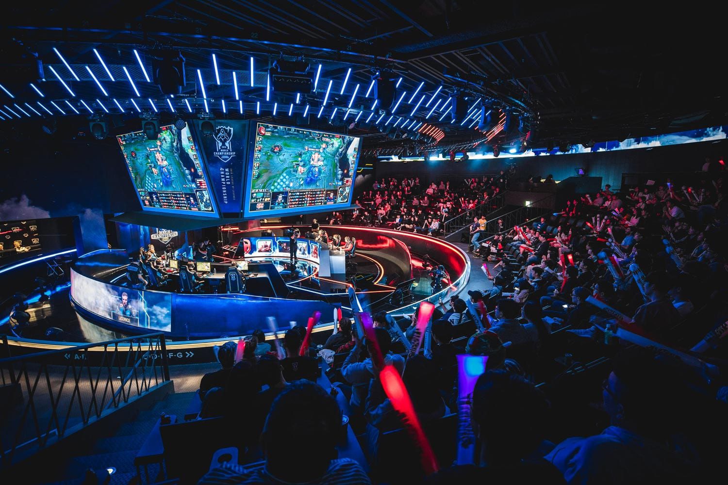 A picture of screens above players at the League of Legends Pro League